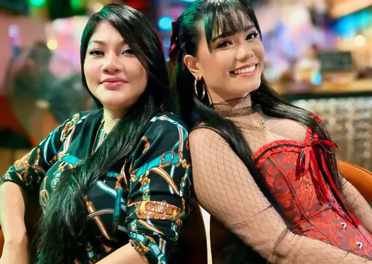 Guests dressed up and smiling on a ladies night at La Vida